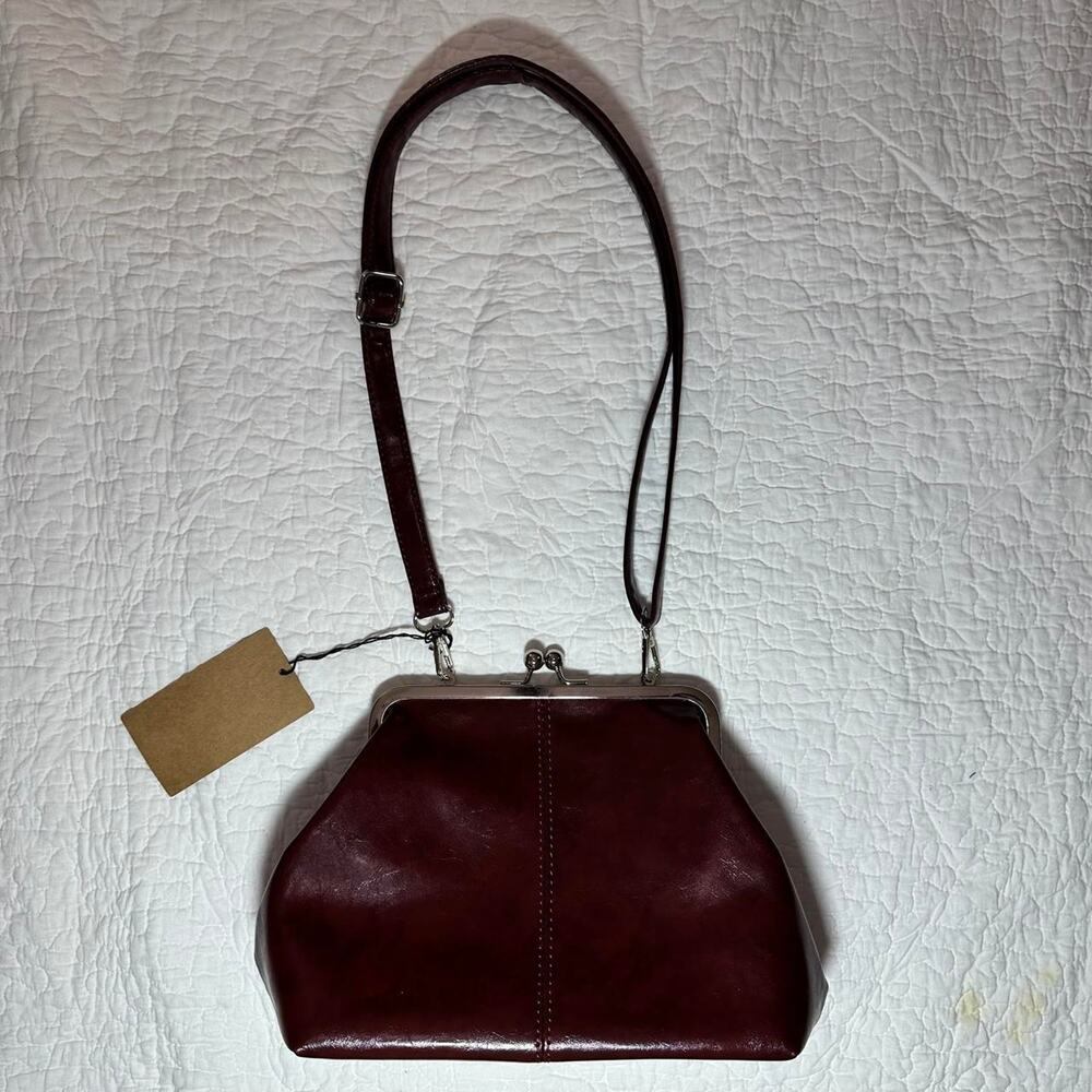 Burgundy crossbody bag with snap closure